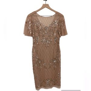 Nude dress with gorgeous beading and mesh details on entire dress. Size 4.